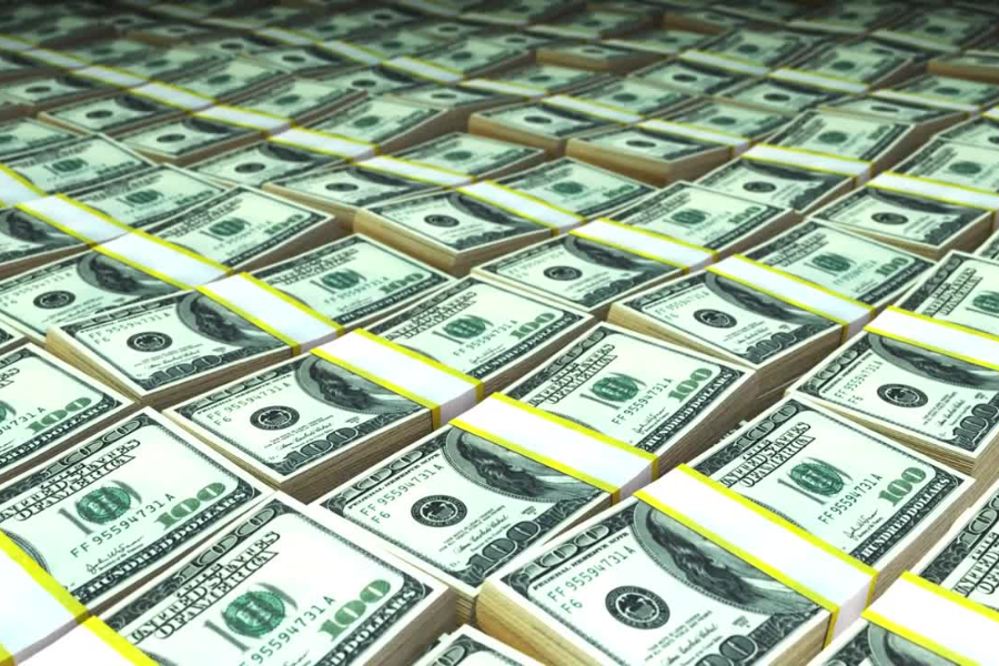 Stacks of one hundred dollar bills representing money printing and inflation