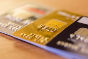 Credit cards on a table, use jewelry to wipe out your debt